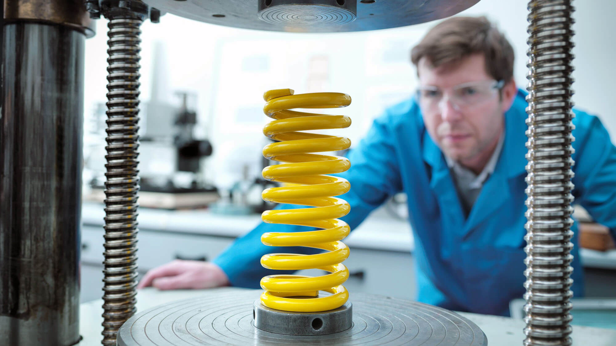 Worker testing spring for durability in laboratory