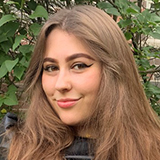 A professional headshot of Claire Groves