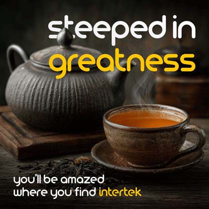 An elegant tea pot and cup full of steaming tea