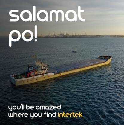 A small cargo ship floating offshore