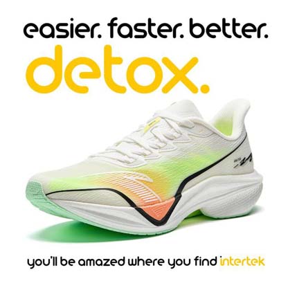 A white jogging shoe with colorful neon markings